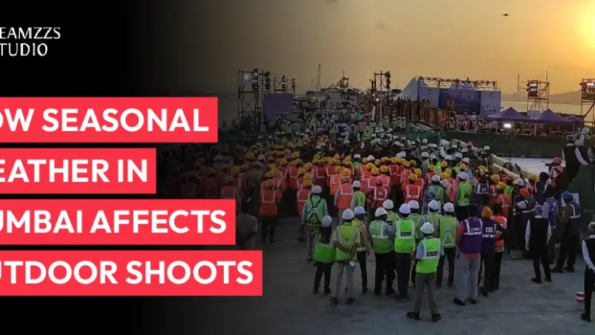 Film crew conducting an outdoor video shoot in Mumbai during changing seasonal weather conditions